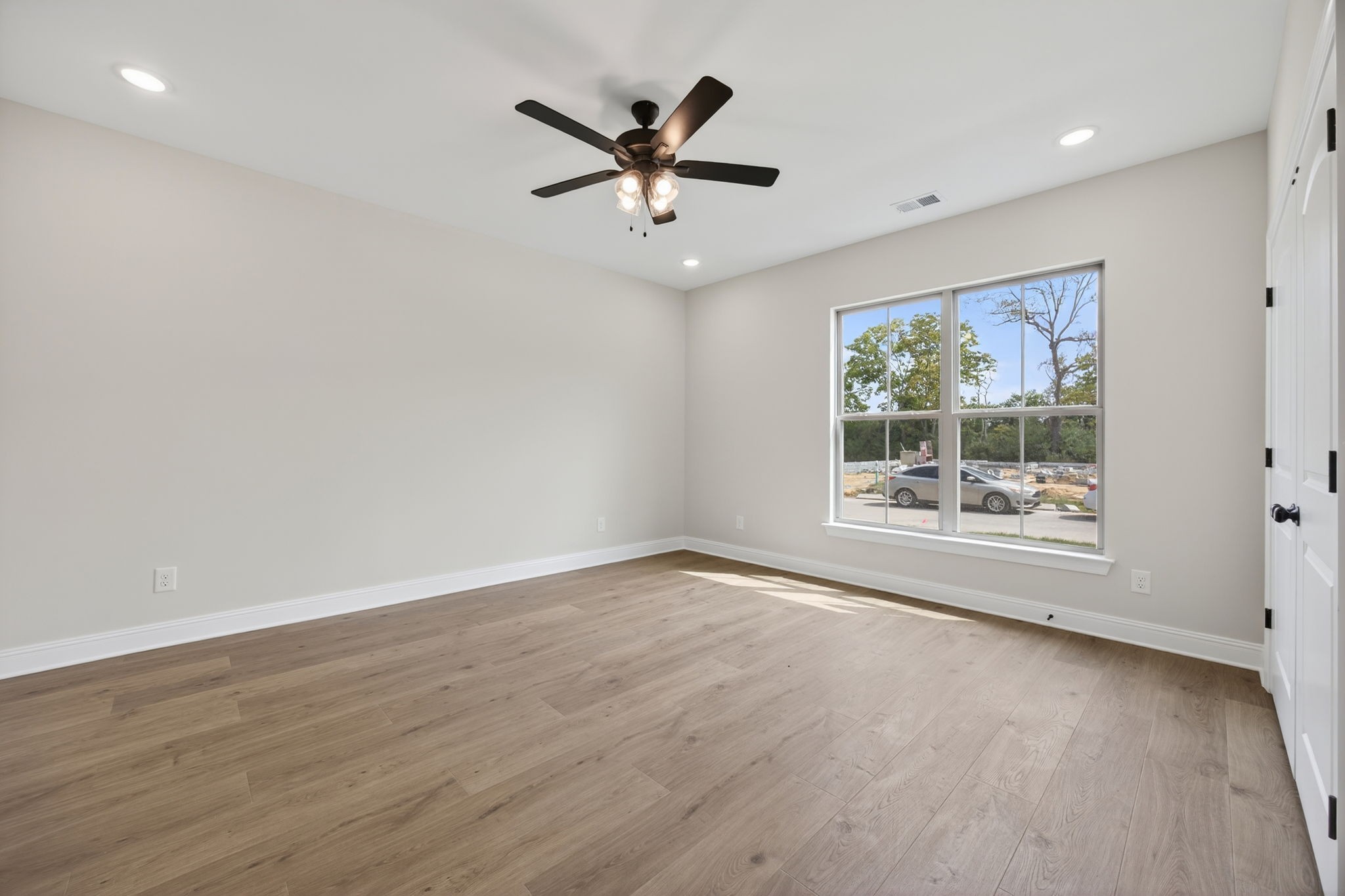 2140 Rylee Way, Unit 45 Greenbrier, TN 37073 - Photo 10 of 42 an empty room with wooden floor and windows