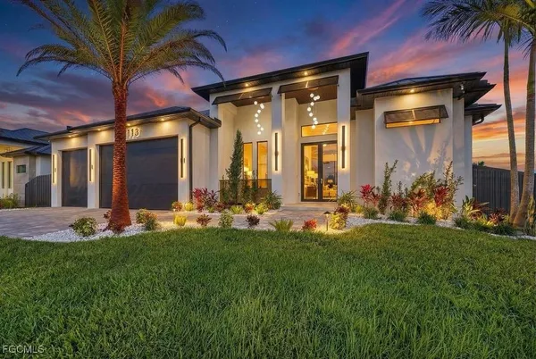 a front view of a house with a yard