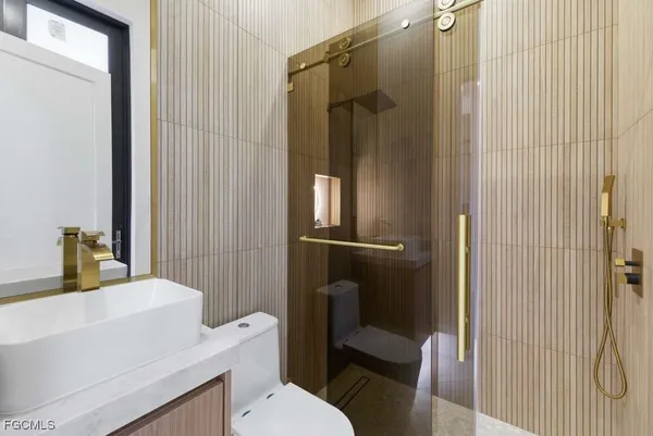 a bathroom with a toilet and shower