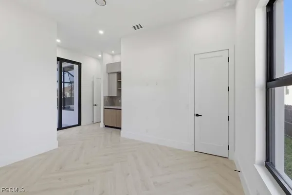 a view of an empty room with a window