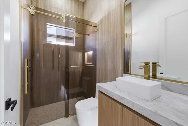 a bathroom with a sink and mirror