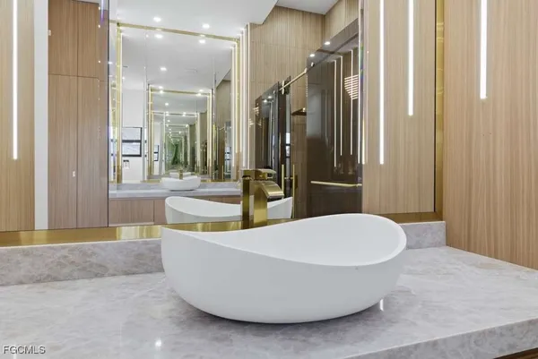 a bathroom with a bathtub and shower