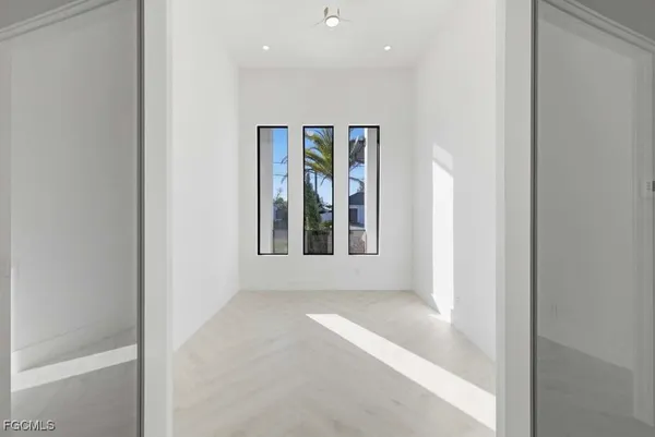 a view of an empty room with a fireplace