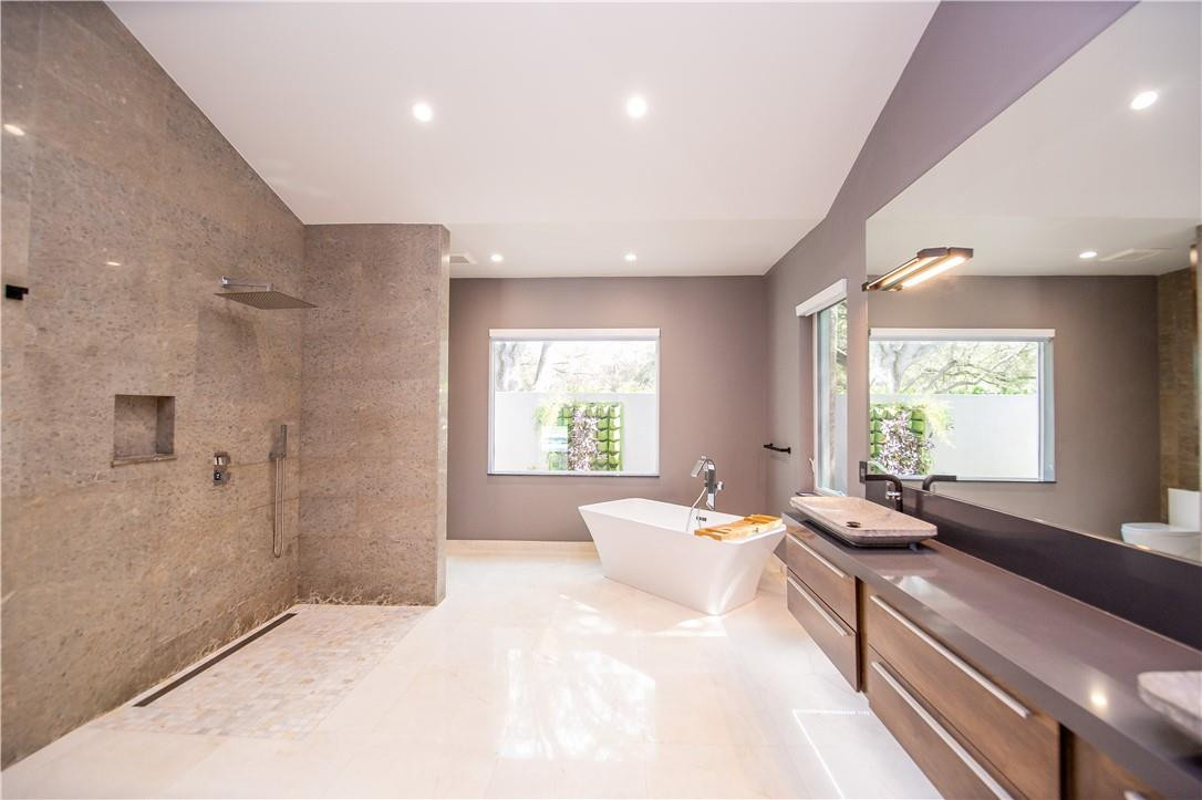 2725 Hackney Road Weston, FL 33331 - Photo 13 of 57 a large bedroom with a large bed and a large window