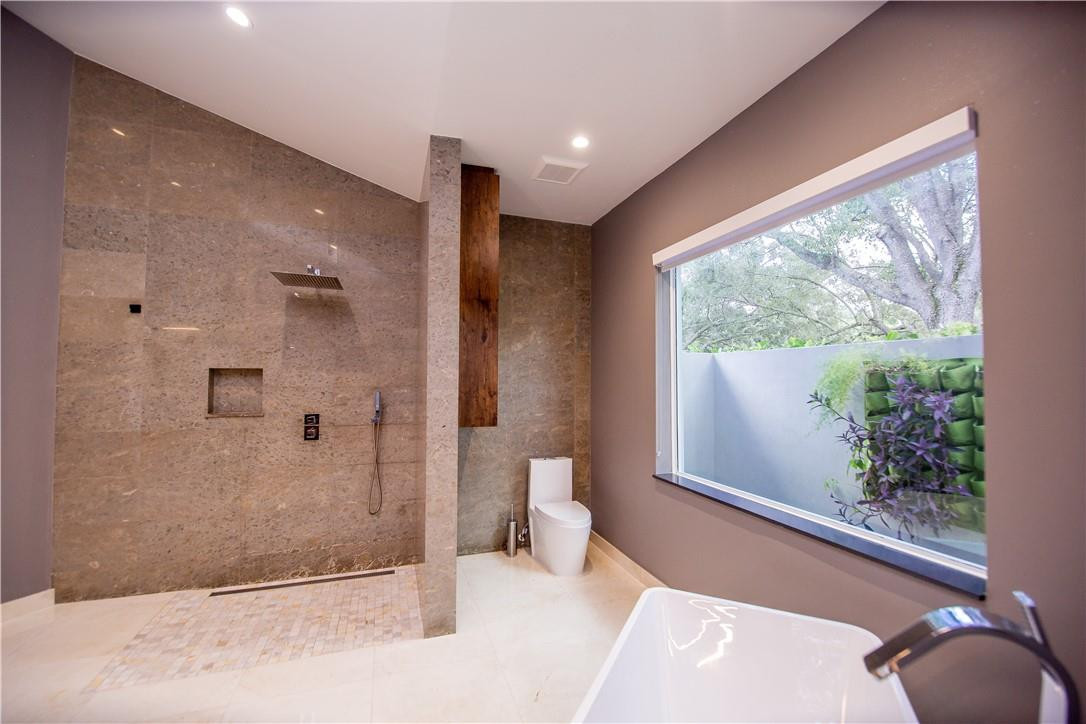 2725 Hackney Road Weston, FL 33331 - Photo 14 of 57 a spacious bathroom with a large tub and shower