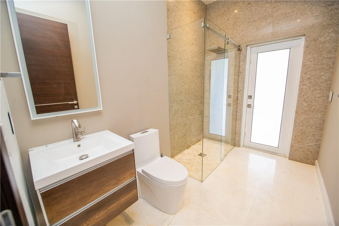 2725 Hackney Road Weston, FL 33331 - Photo 20 of 57 a bathroom with a sink a toilet and shower