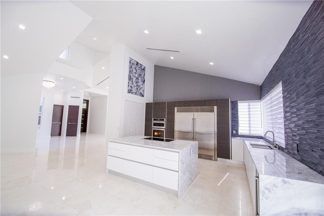 2725 Hackney Road Weston, FL 33331 - Photo 24 of 57 a view of a hallway with a couch and a fireplace