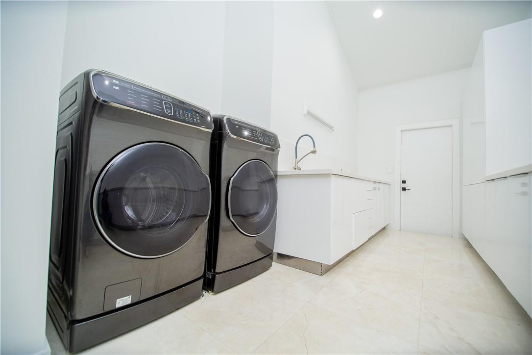 2725 Hackney Road Weston, FL 33331 - Photo 28 of 57 a utility room with dryer and washer