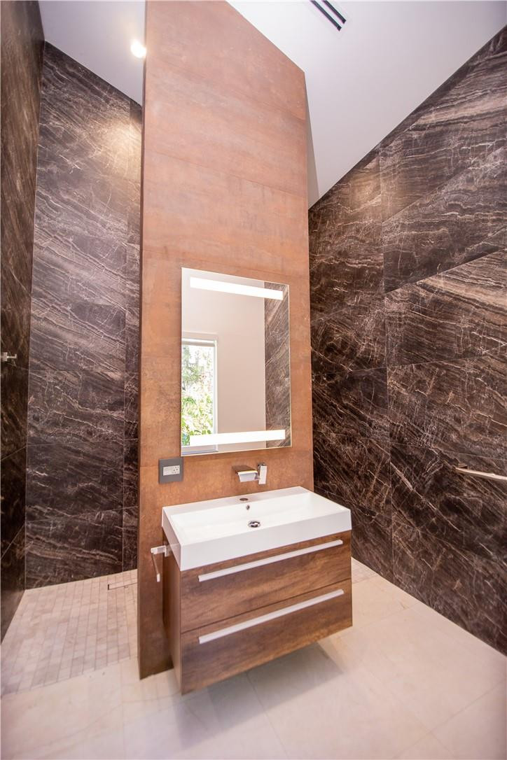 2725 Hackney Road Weston, FL 33331 - Photo 33 of 57 a spacious bathroom with a sink and a mirror