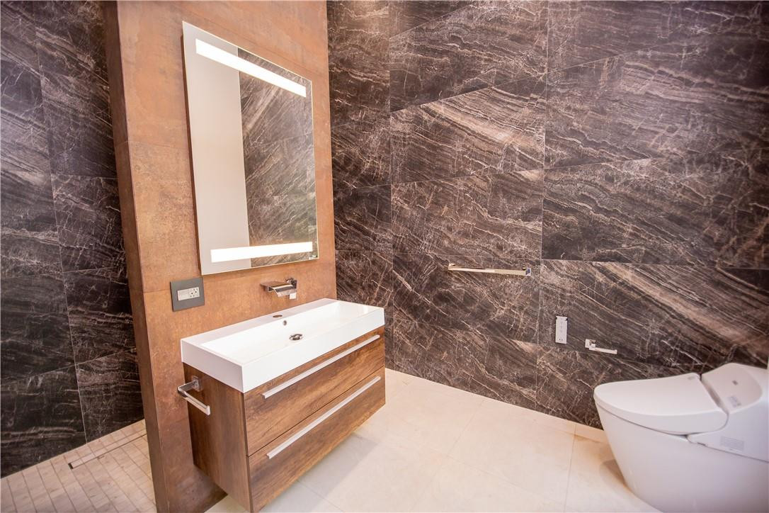 2725 Hackney Road Weston, FL 33331 - Photo 34 of 57 a bathroom with a sink a toilet and shower