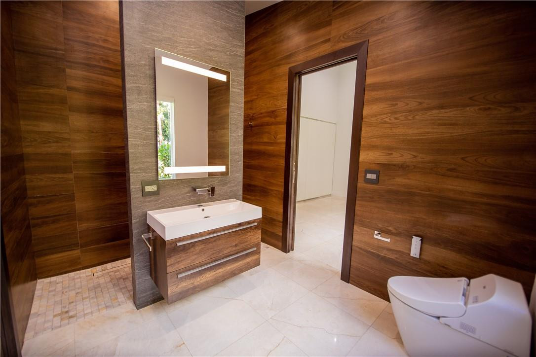 2725 Hackney Road Weston, FL 33331 - Photo 39 of 57 a bathroom with a sink a toilet and shower