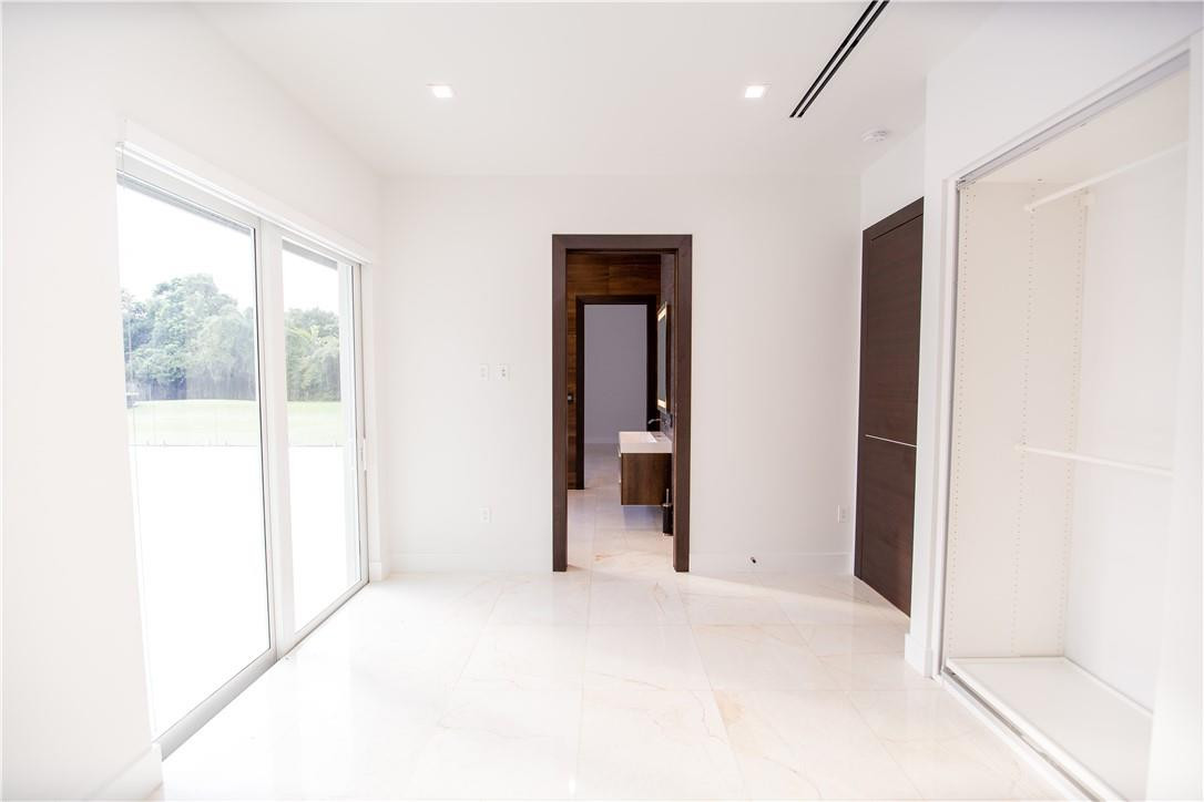 2725 Hackney Road Weston, FL 33331 - Photo 40 of 57 a view of an empty room with glass door