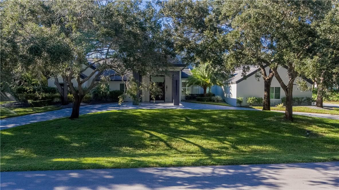 2725 Hackney Road Weston, FL 33331 - Photo 4 of 57 a view of a backyard with large trees