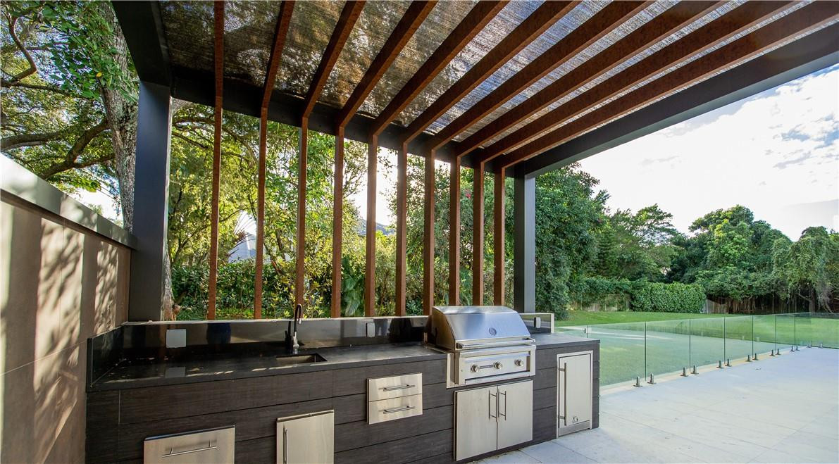 2725 Hackney Road Weston, FL 33331 - Photo 41 of 57 a kitchen with stainless steel appliances granite countertop a stove a sink and a refrigerator