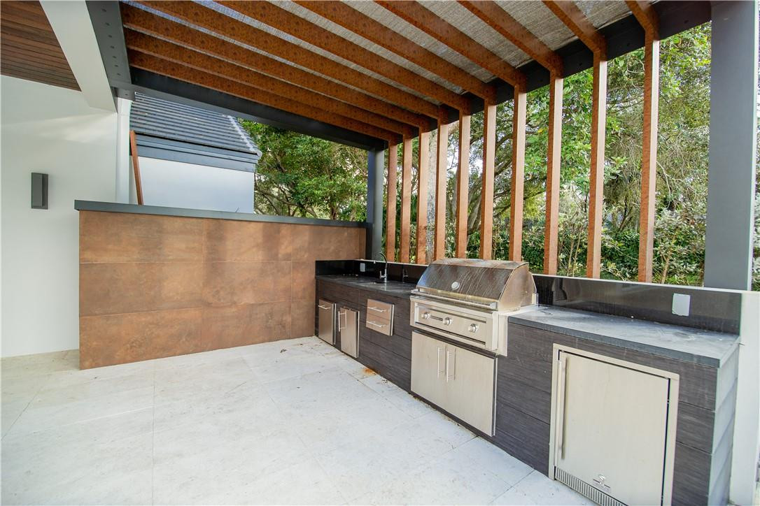2725 Hackney Road Weston, FL 33331 - Photo 42 of 57 a kitchen with a stove and a microwave
