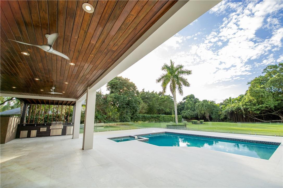 2725 Hackney Road Weston, FL 33331 - Photo 43 of 57 a view of a swimming pool with a yard and plants