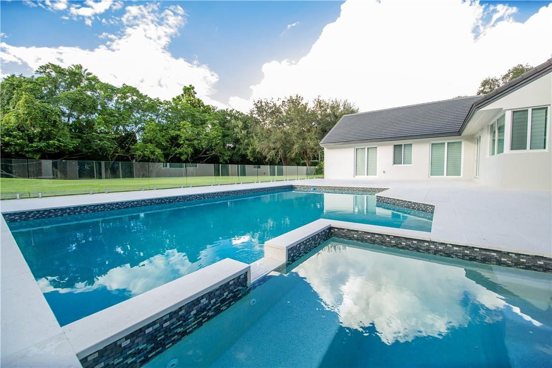 2725 Hackney Road Weston, FL 33331 - Photo 45 of 57 a view of a house with a swimming pool