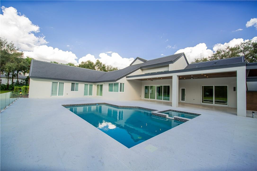 2725 Hackney Road Weston, FL 33331 - Photo 46 of 57 front view of house with a yard