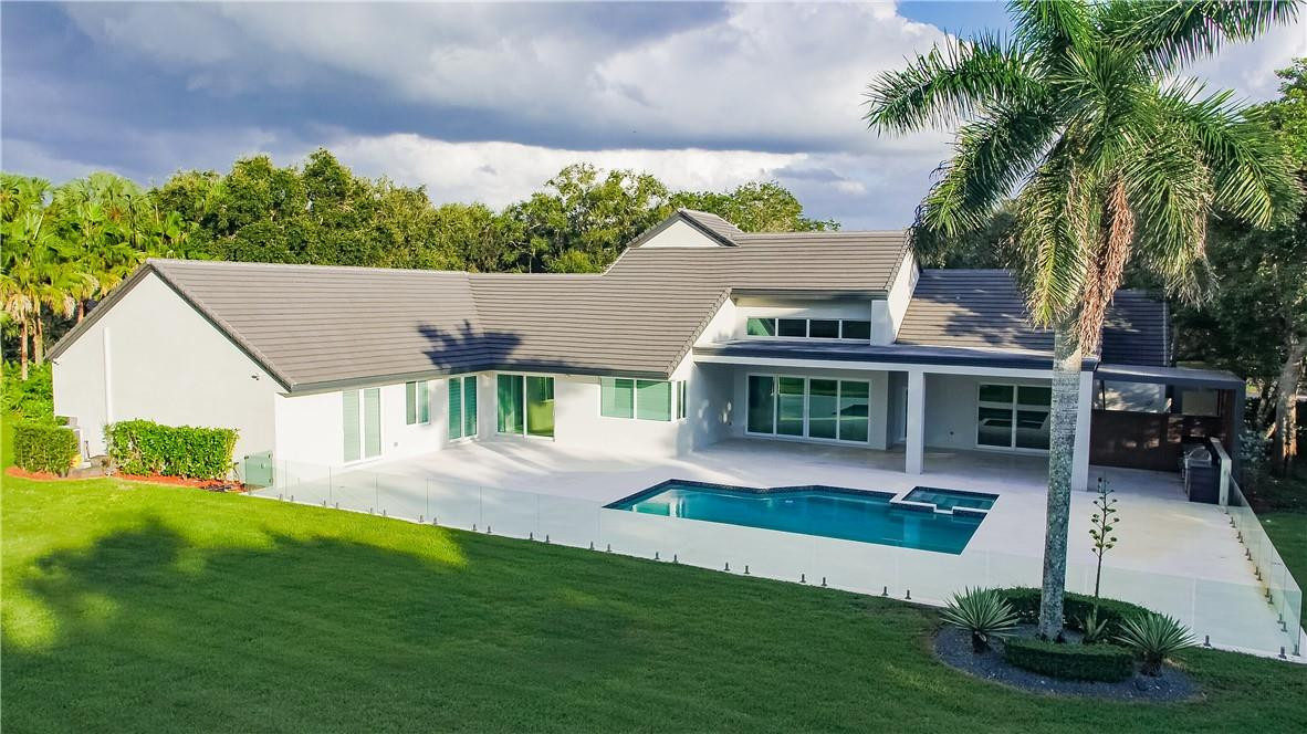 2725 Hackney Road Weston, FL 33331 - Photo 47 of 57 a view of house with yard and green space