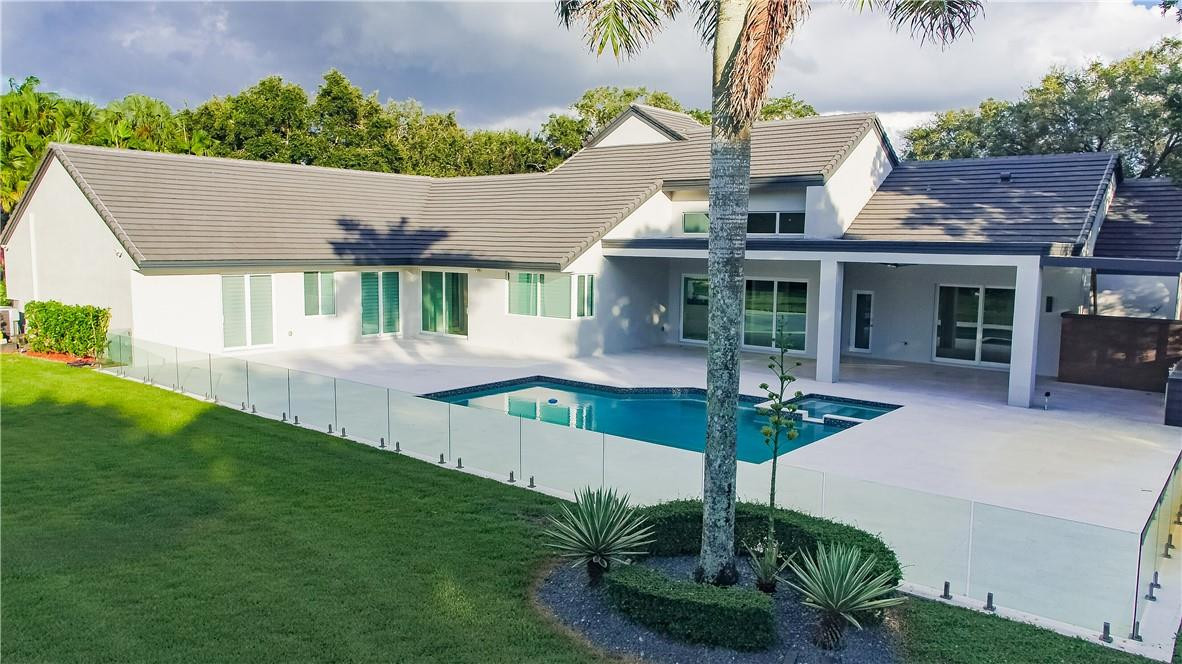 2725 Hackney Road Weston, FL 33331 - Photo 50 of 57 a front view of a house with garden