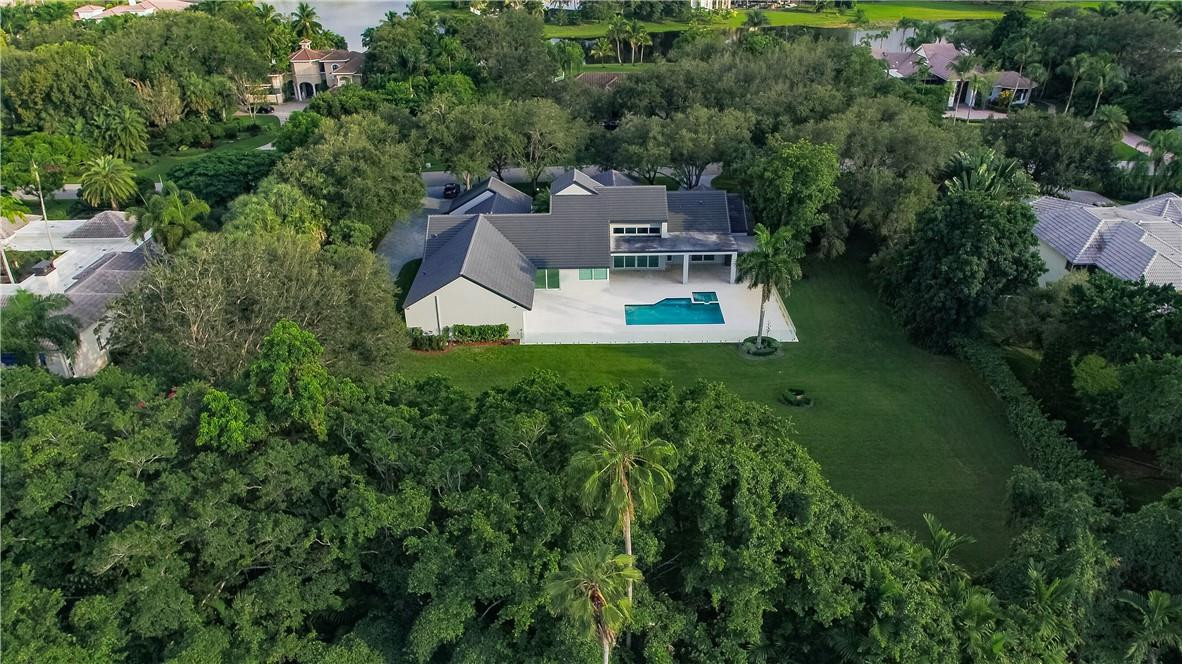 2725 Hackney Road Weston, FL 33331 - Photo 5 of 57 an aerial view of a house with a garden