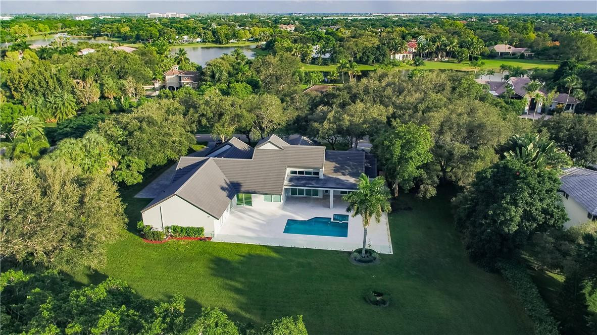 2725 Hackney Road Weston, FL 33331 - Photo 54 of 57 an aerial view of a house with a yard