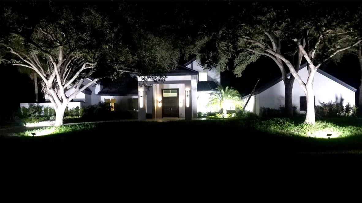 2725 Hackney Road Weston, FL 33331 - Photo 6 of 57 a view of a house with a large tree and a yard