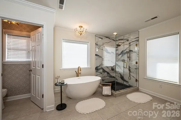 a bathroom with a toilet a sink and bathtub