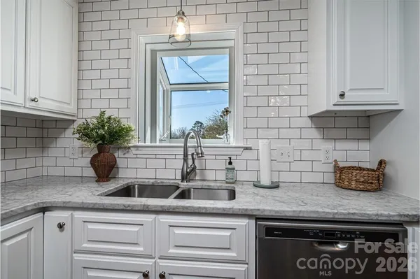 a kitchen with a sink and cabinets