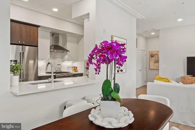 a dining room with furniture and wooden floor