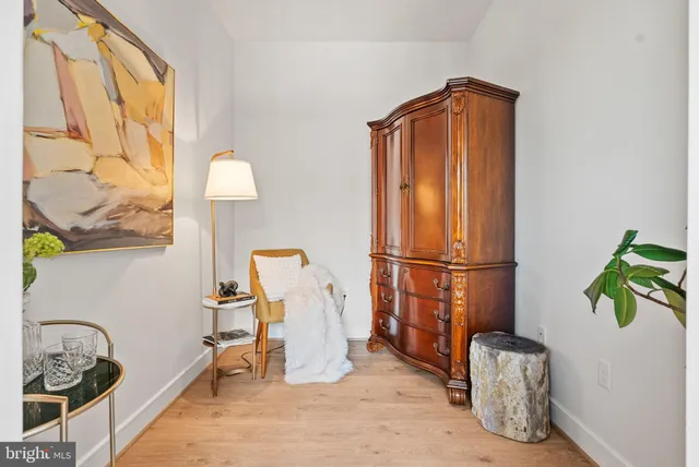 a kitchen with stainless steel appliances granite countertop a stove and a wooden floor