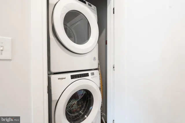 a bathroom with a shower curtain and a toilet
