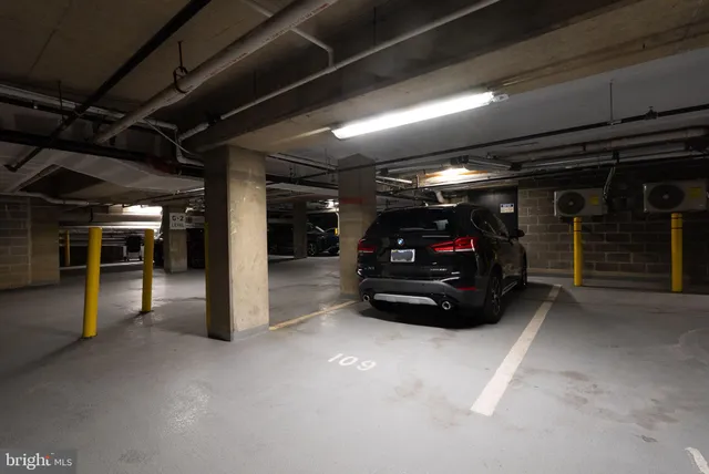 a view of a garage with a bike and car