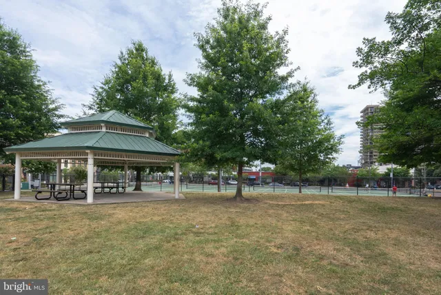 a group of people sitting outside of a building
