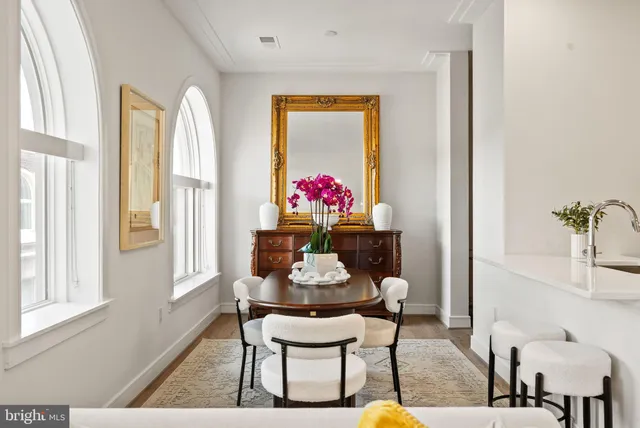 a dining room with furniture and window