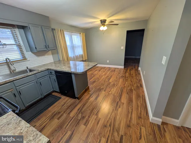 workspace with wooden floor and staircase
