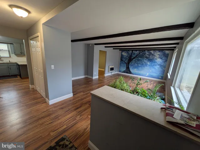a living room with wooden floor
