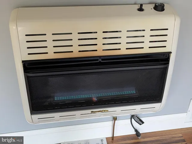 a close view of stove a microwave and cabinets