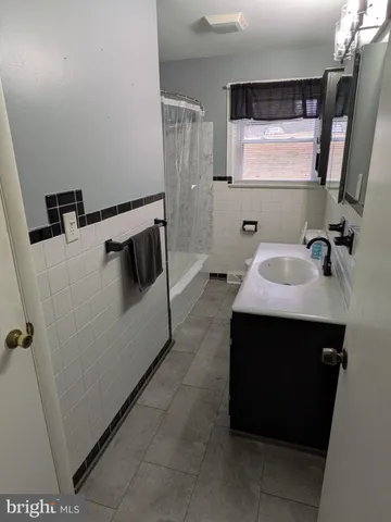 a bathroom with a sink and mirror