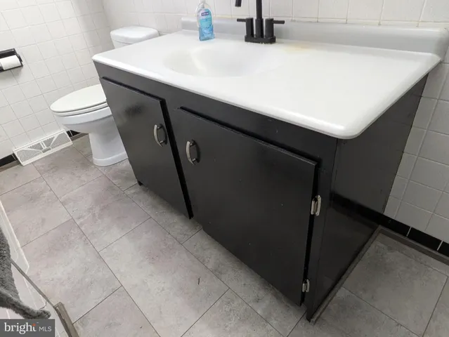 a bathroom with a sink and a toilet