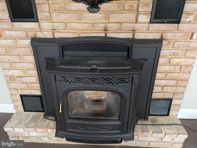 a close view of a fireplace in wooden floor