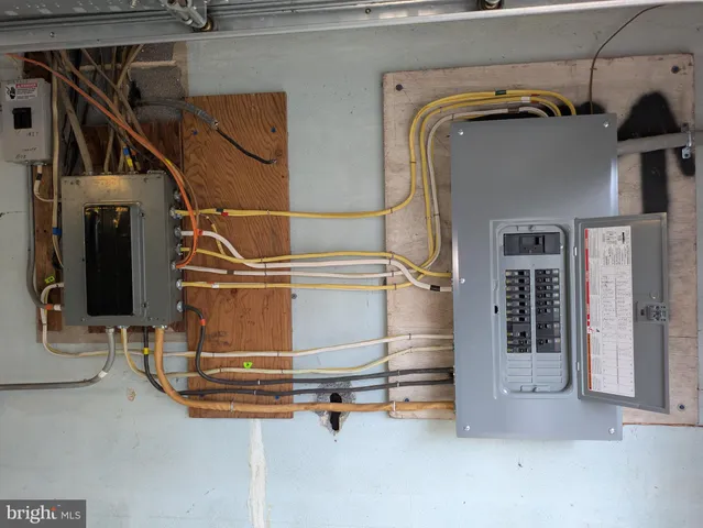 a utility room with multiple dryer and washer