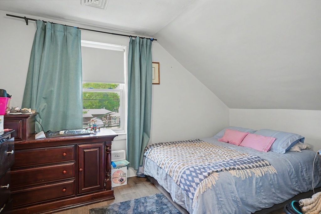 5 Eddy Street, Unit 2 Webster, MA 01570 - Photo 15 of 18 a bedroom with a bed and a window