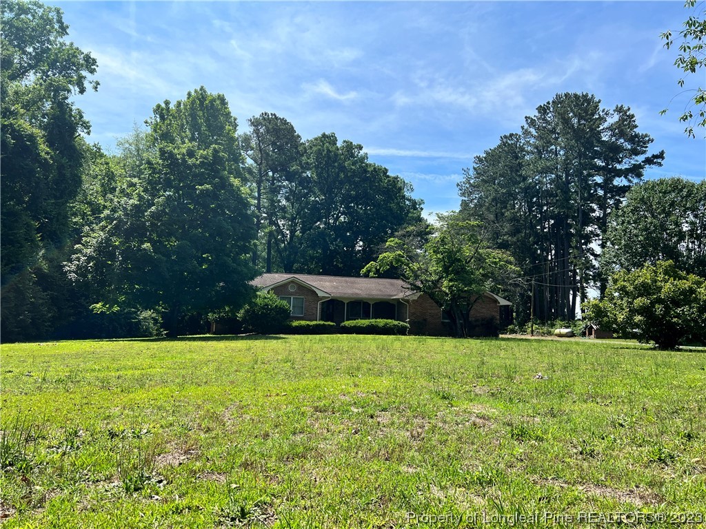 1997 Jenkins Road Fairmont, NC 28340 - Photo 1 of 47 a swimming pool with outdoor seating and yard
