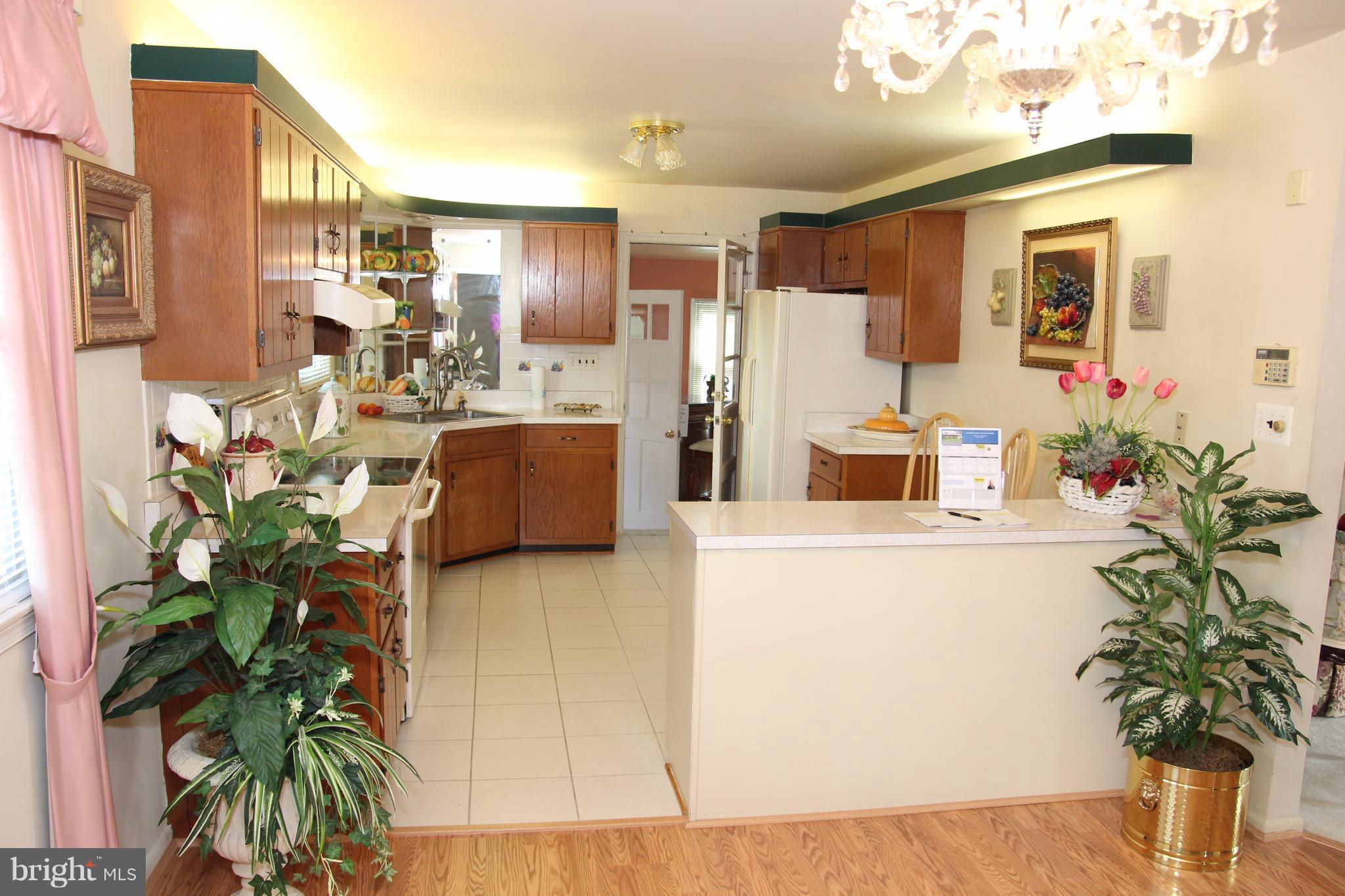 3413 Dunnington Road Beltsville, MD 20705 - Photo 11 of 16 a living room with furniture and a potted plant