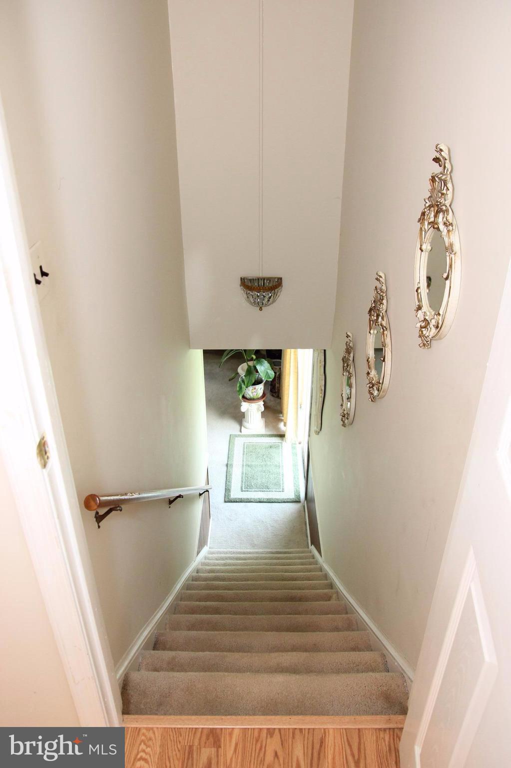 3413 Dunnington Road Beltsville, MD 20705 - Photo 12 of 16 a view of a hallway to a house with wooden floor