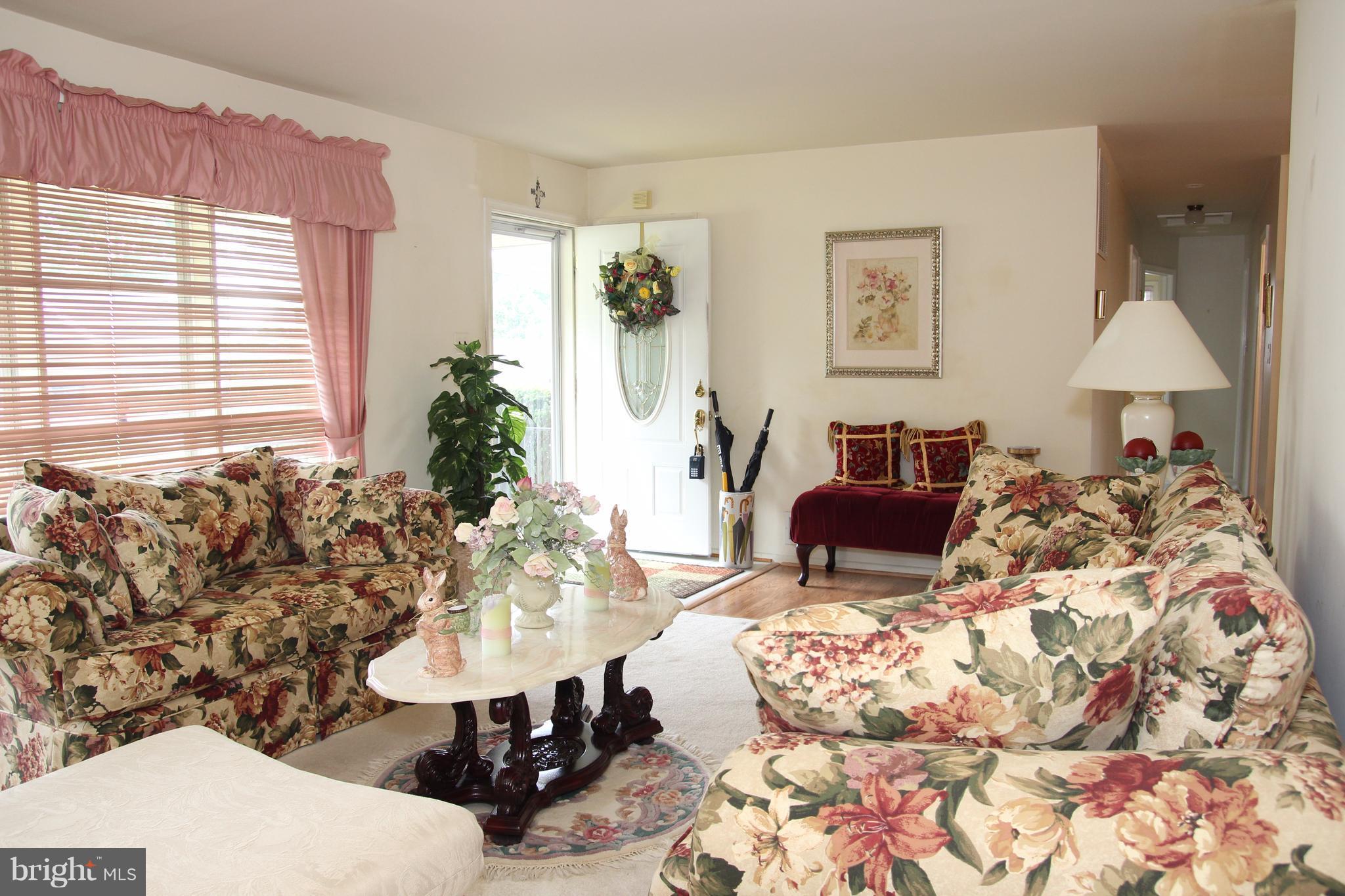 3413 Dunnington Road Beltsville, MD 20705 - Photo 3 of 16 a living room with furniture and a table