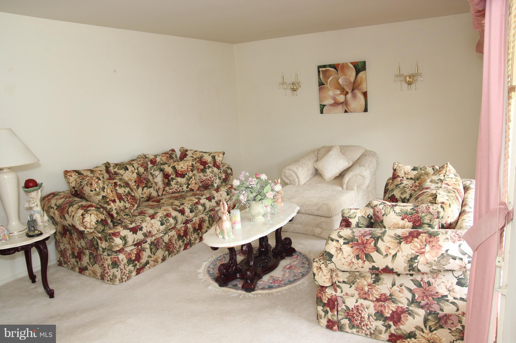 3413 Dunnington Road Beltsville, MD 20705 - Photo 4 of 16 a bed with a white comforter and pillows