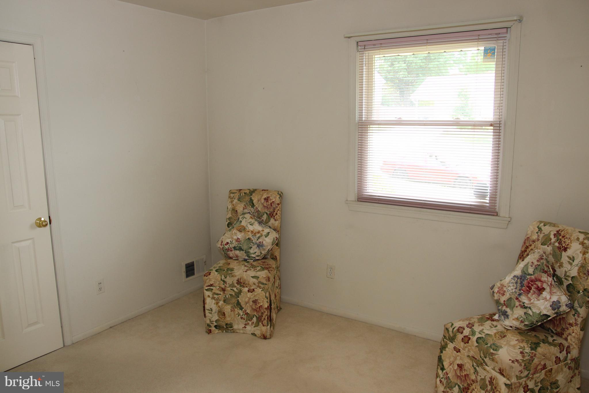 3413 Dunnington Road Beltsville, MD 20705 - Photo 8 of 16 a room with a bed and a window