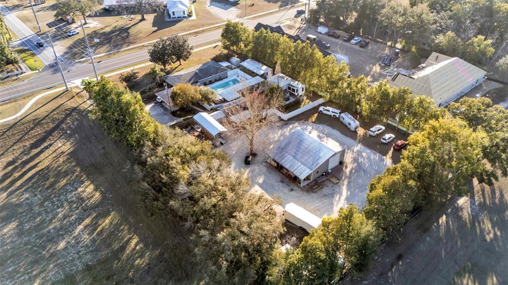 3830 Clubhouse Road Lakeland, FL 33812 - Photo 20 of 42 an aerial view of residential house with outdoor space and trees all around